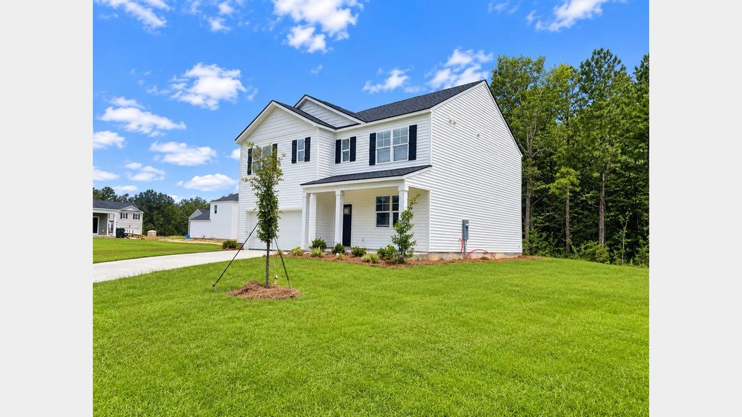 Front exterior of a new home in Cypress Landing, Hardeeville, SC, highlighting curb appeal (Image 2).