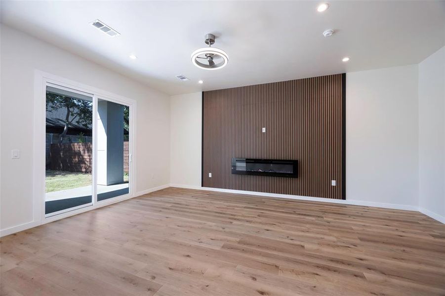 Living room with light hardwood / wood-style floors