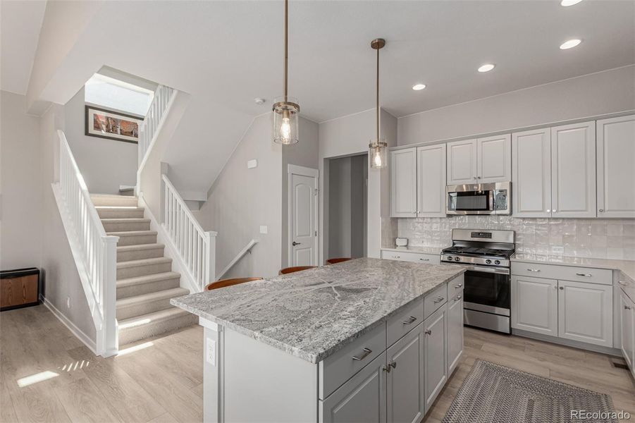 Kitchen with stairs leading up to the third floor Kitchen with stairs leading up to the third floor