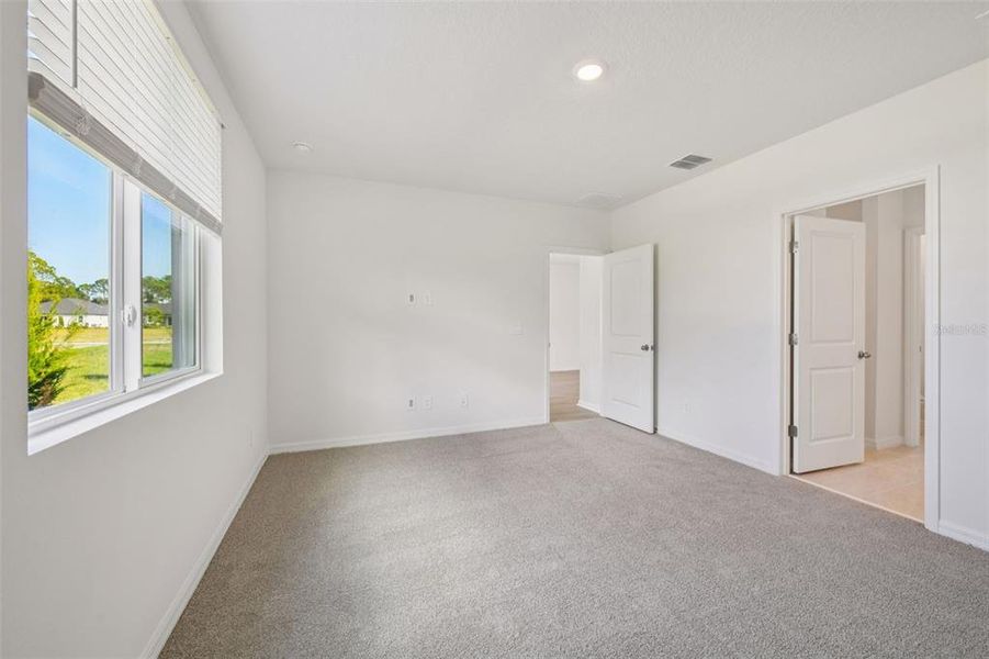 Spacious, unfurnished interior of a new home in Ridgehaven - Villas, Ormond Beach (Image 27).