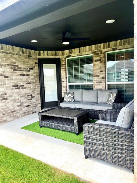 View of patio with ceiling fan and an outdoor living space View of patio with ceiling fan and an outdoor living space