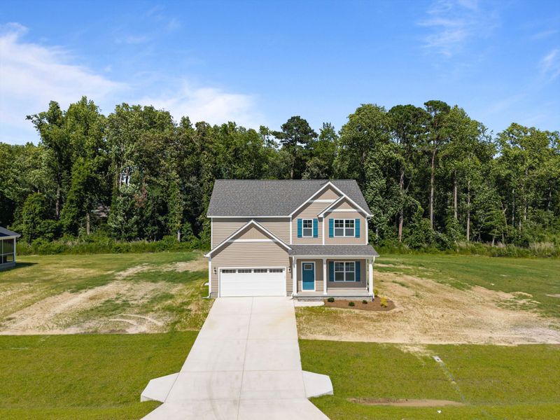 Front exterior of a new home in Laurel Oaks, Greenville, NC, highlighting curb appeal (Image 31). Front exterior of a new home in Laurel Oaks, Greenville, NC, highlighting curb appeal (Image 31).
