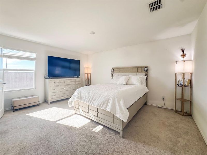 Carpeted bedroom featuring baseboards