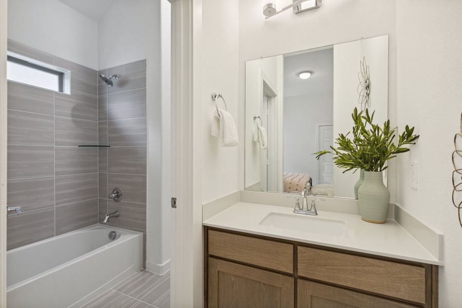 Bathroom in the Gilmour home plan by Trophy Signature Homes – REPRESENTATIVE PHOTO