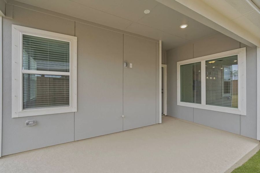 Representative exterior details of a home built from the Carriagehouse by Chesmar Homes in Meridiana Townhomes, Iowa Colony (Image 40).