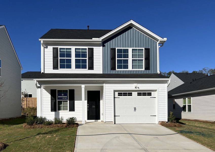 Front exterior of a new home in Braxton Place, Moore, SC, highlighting curb appeal (Image 1).
