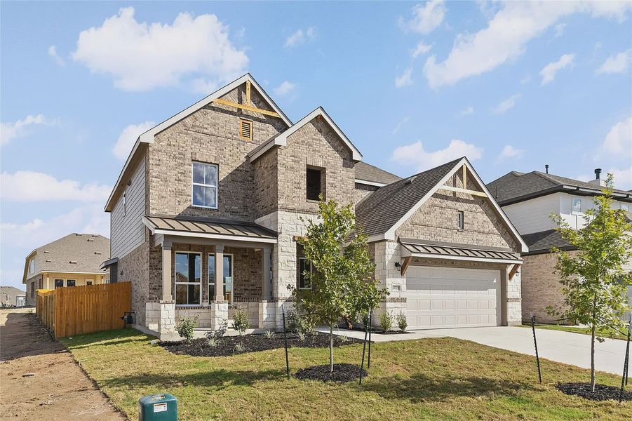 Front exterior of a new home in The Grove at Blackhawk, Pflugerville, TX, highlighting curb appeal (Image 21).