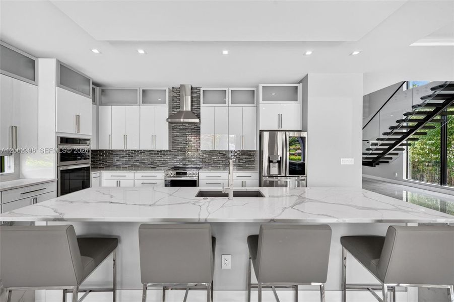 Chef's kitchen w/ counter seating, quartz waterfalls, 2 ovens, pot filler, tons of storage, KraftMaid cabinets
