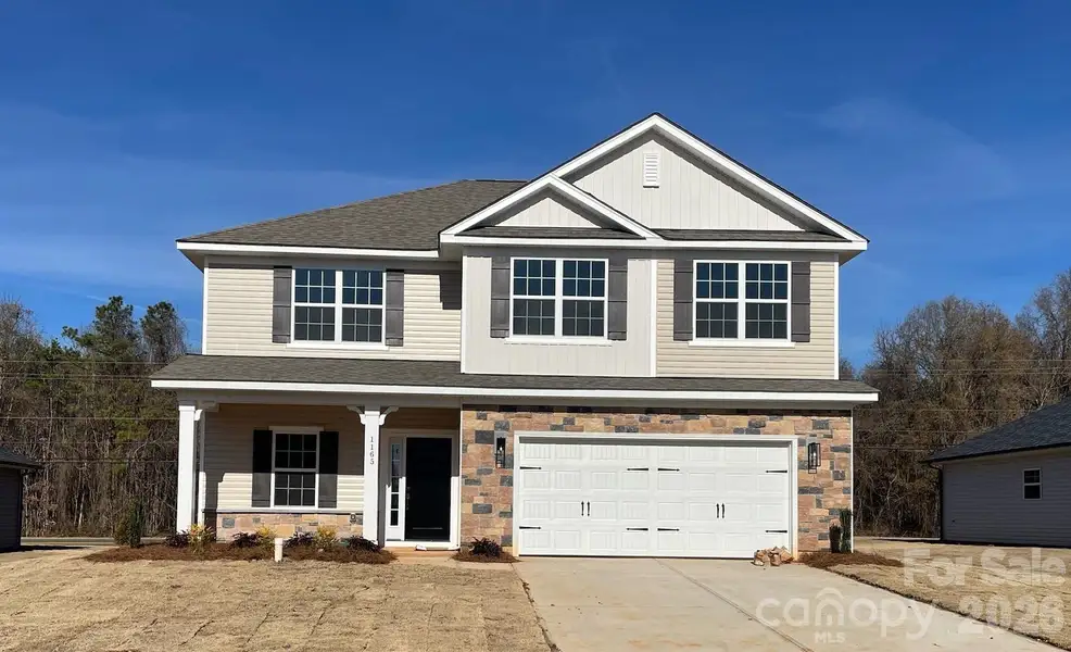 Front exterior of a new home in Kerns Ridge, Salisbury, NC, highlighting curb appeal (Image 1). Front exterior of a new home in Kerns Ridge, Salisbury, NC, highlighting curb appeal (Image 1).