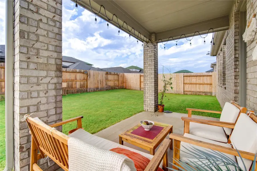 The covered veranda is the perfect area for outdoor relazation, pairs perfectly with the magnificent expansive backyard. This inviting space is ideal for entertaining and hosting memorable backyard gatherings with family and friends.