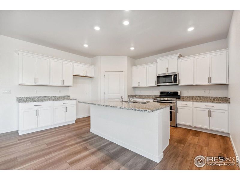 Furnished interior view inside a new home in Silver Peaks, Lochbuie (Image 5).