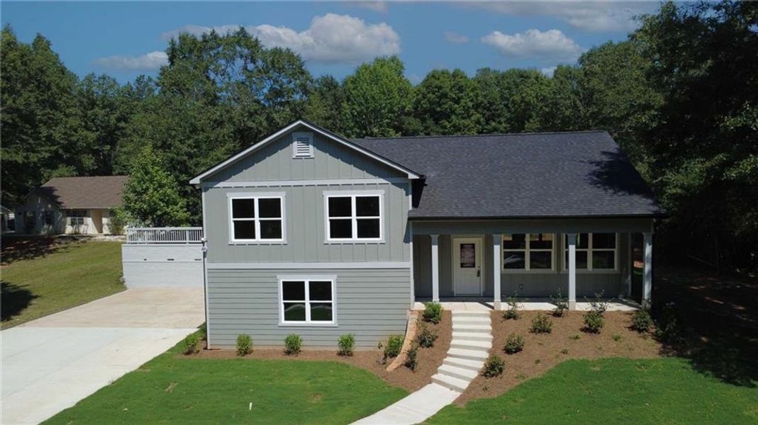 Front exterior of a new home in , Covington, GA, highlighting curb appeal (Image 19).