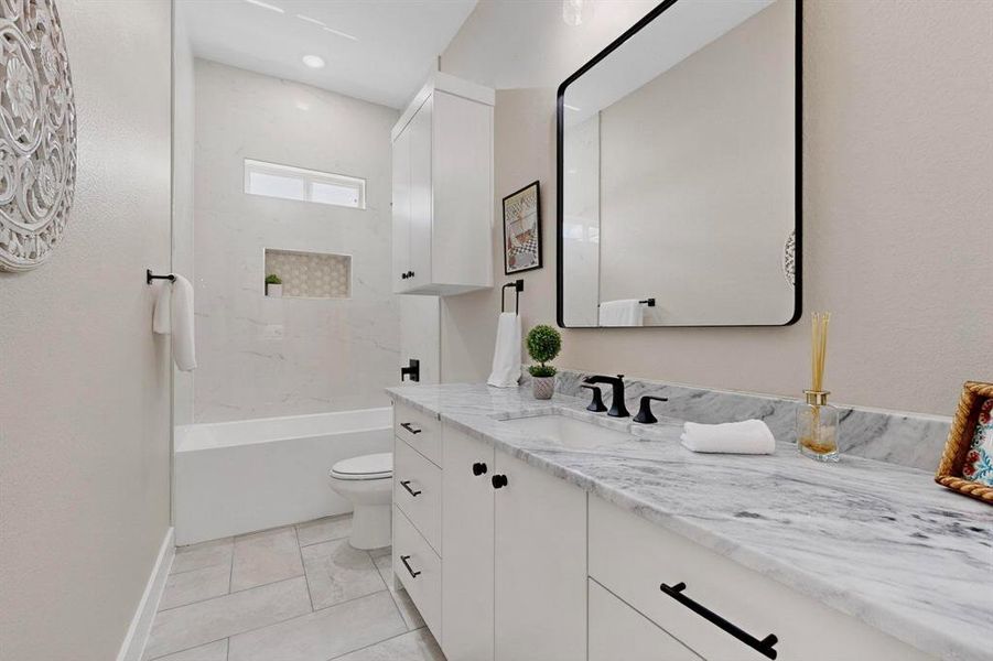 Bathroom featuring vanity and tub / shower combination