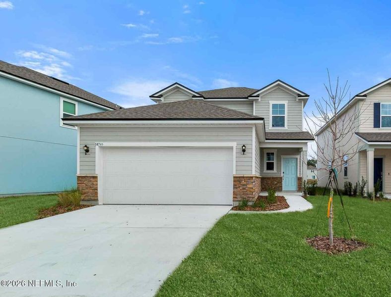Front exterior of a new home in , Jacksonville, FL, highlighting curb appeal (Image 18).