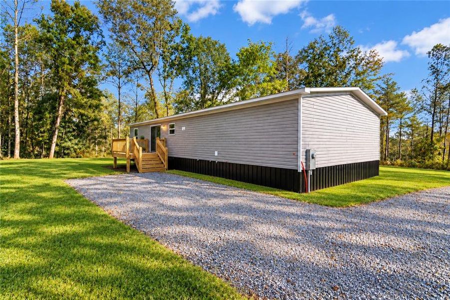 Exterior details and patio area of a home in , Ellijay (Image 25).