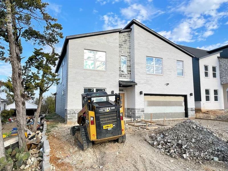 Front exterior of a new home in , Dallas, TX, highlighting curb appeal (Image 1).