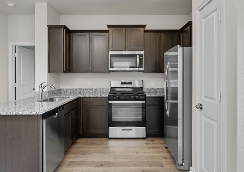 The kitchen has energy-efficient, stainless-steel appliances.