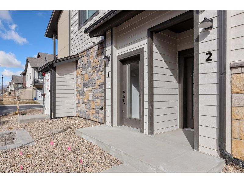 Exterior details and patio area of a home in Northfield at Old Town - Vista Collection, Fort Collins (Image 15).