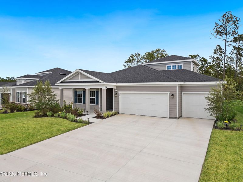 Front exterior of a new home in Seminole Palms Single-Family Homes, Palm Coast, FL, highlighting curb appeal (Image 24).