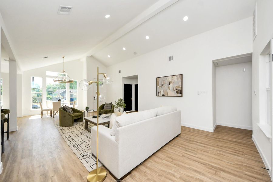 An open, light-filled space where high ceilings and modern lighting create a sense of ease and elegance. Thoughtfully furnished with cozy seating and a dining area that feels both stylish and relaxed—perfect for everyday living or effortless entertaining. An open, light-filled space where high ceilings and modern lighting create a sense of ease and elegance. Thoughtfully furnished with cozy seating and a dining area that feels both stylish and relaxed—perfect for everyday living or effortless entertaining.