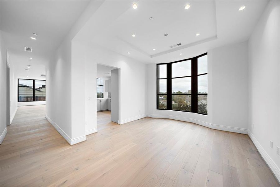 Formal Dining: Separate formal dining area is a sophisticated space characterized by high ceilings & a large window. A special place for dinner parties and family gatherings.