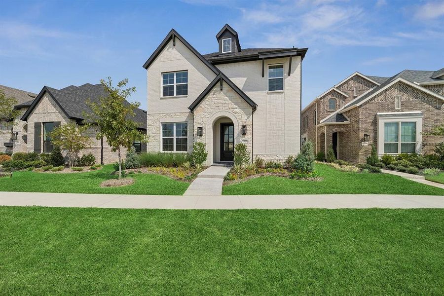 Front exterior of a new home in Mantua Point Gardens, Van Alstyne, TX, highlighting curb appeal (Image 2). Front exterior of a new home in Mantua Point Gardens, Van Alstyne, TX, highlighting curb appeal (Image 2).