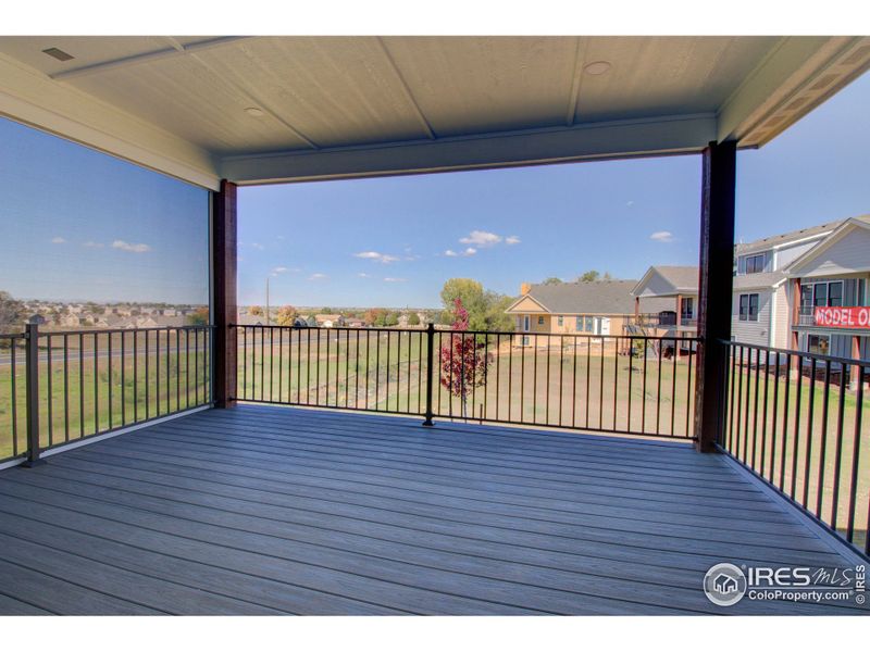 The back deck looks out inot the open space with moutain views beyond