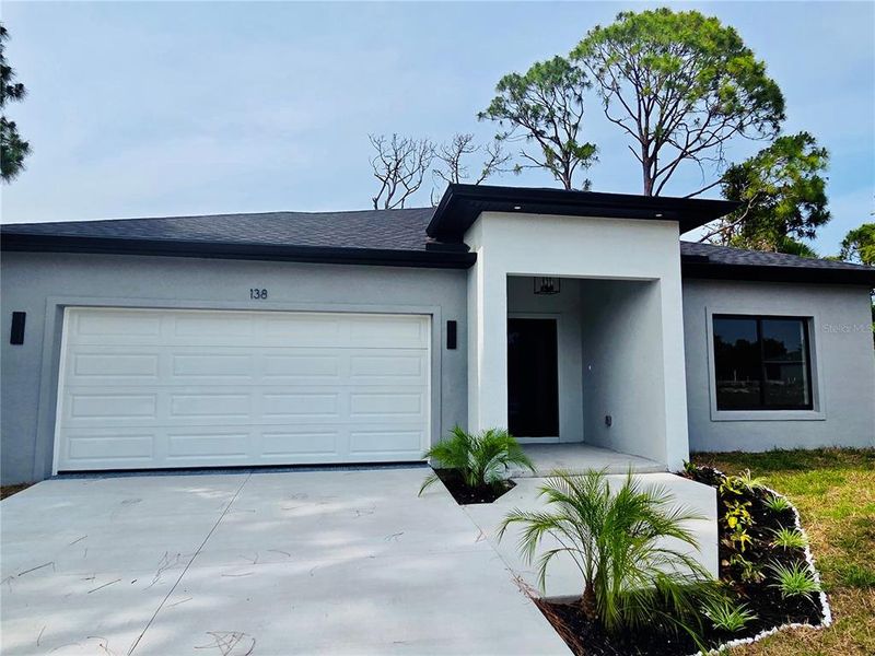 Front exterior of a new home in , Rotonda West, FL, highlighting curb appeal (Image 15). Front exterior of a new home in , Rotonda West, FL, highlighting curb appeal (Image 15).