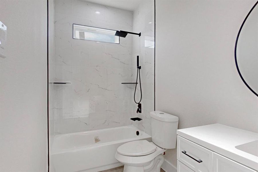 Bathroom featuring vanity and shower / bathtub combination Bathroom featuring vanity and shower / bathtub combination