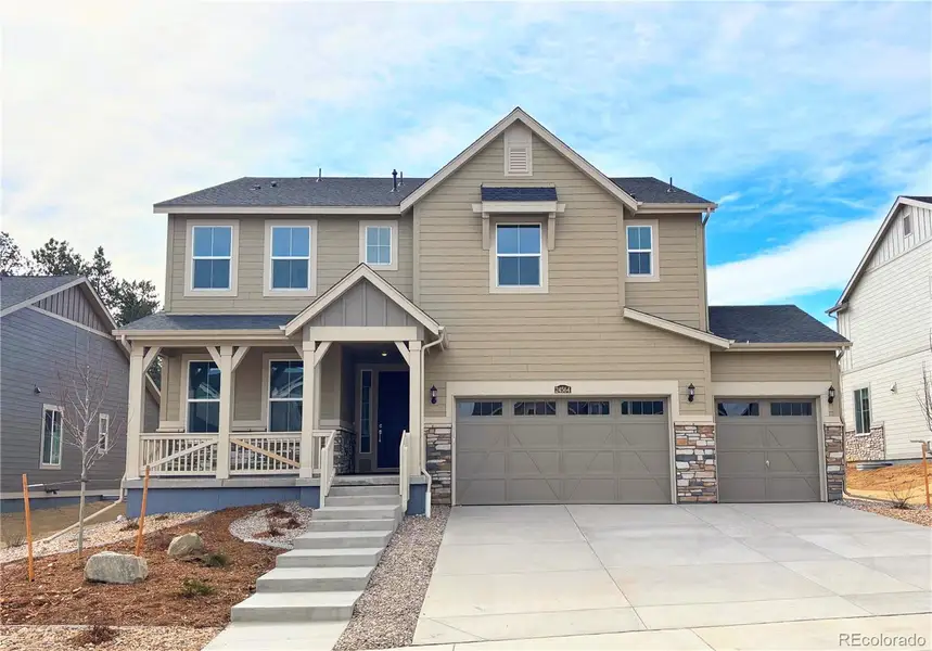 Front exterior of a new home in Guilford Estates, Aurora, CO, highlighting curb appeal (Image 2).