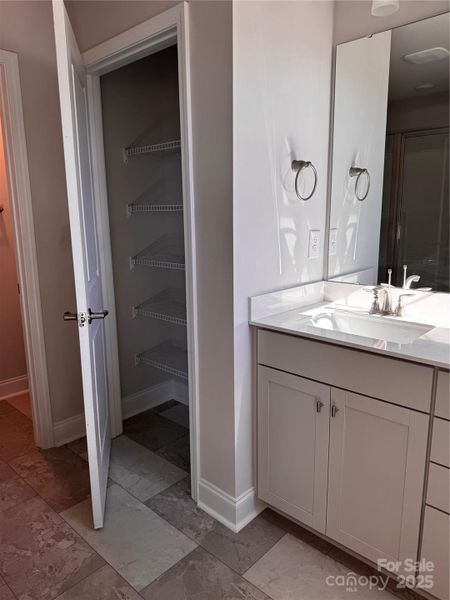 Linen closet in primary bathroom Representative Photo