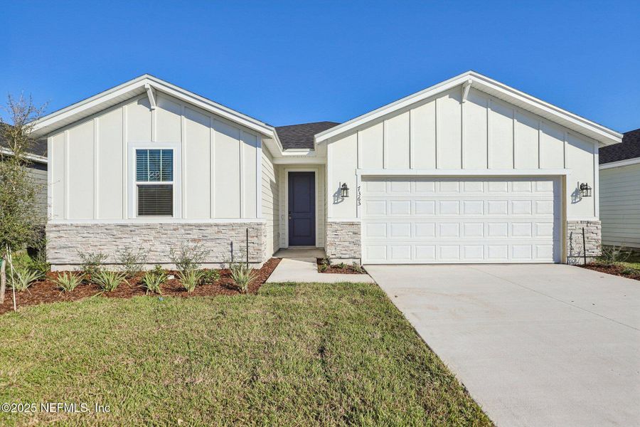 Front exterior of a new home in Cypress Meadows - Signature Series, Jacksonville, FL, highlighting curb appeal (Image 1).