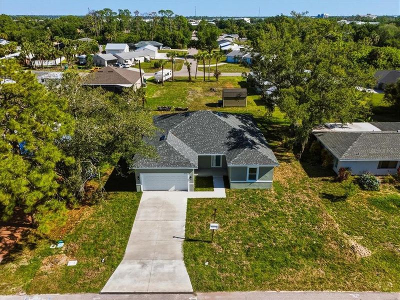 Front exterior of a new home in , Port Charlotte, FL, highlighting curb appeal (Image 27).