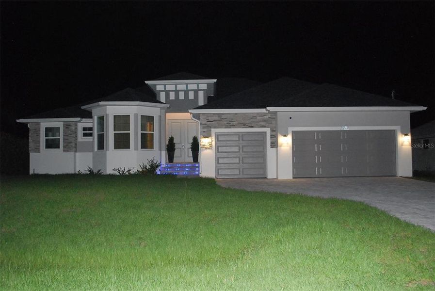 Front exterior of a new home in , Port Charlotte, FL, highlighting curb appeal (Image 27).