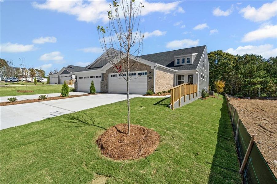 Front exterior of a new home in Villas at Gold Creek, Dawsonville, GA, highlighting curb appeal (Image 1). Front exterior of a new home in Villas at Gold Creek, Dawsonville, GA, highlighting curb appeal (Image 1).