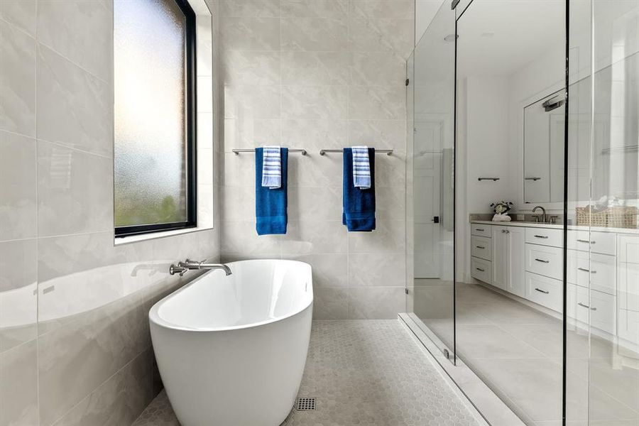 Soaking tub in shower area. Soaking tub in shower area.