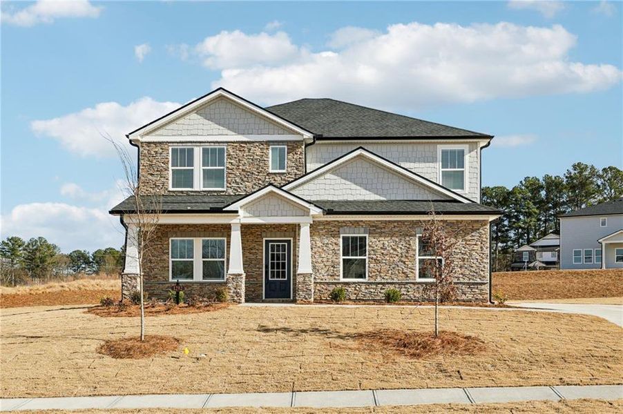 Front exterior of a new home in River Pointe, Monroe, GA, highlighting curb appeal (Image 30).