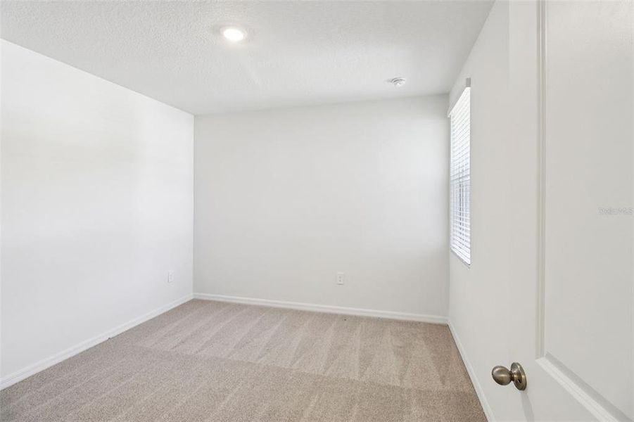 Spacious, unfurnished interior of a new home in Ridgehaven - Villas, Ormond Beach (Image 27).