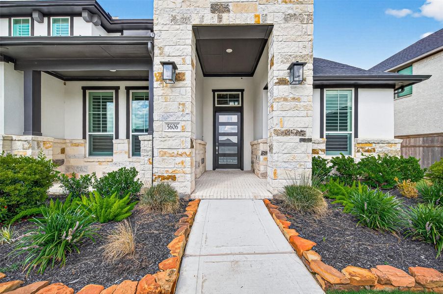 Beautiful brick, stone, and stucco elevation.