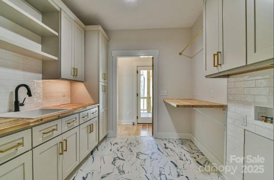 Large laundry room with tons of storage. Similar photo.