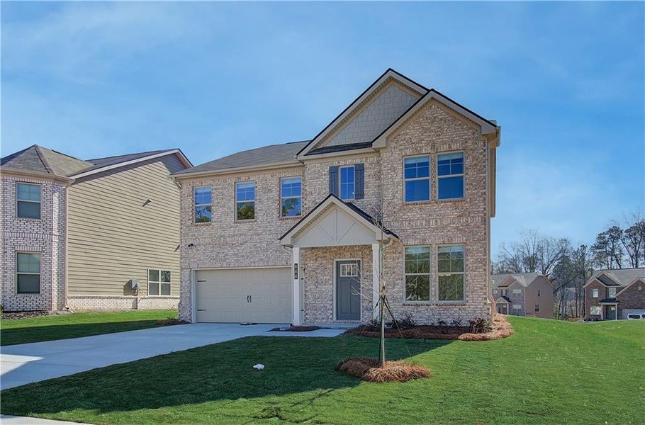 Front exterior of a new home in Cedar Grove Commons, Conley, GA, highlighting curb appeal (Image 2). Front exterior of a new home in Cedar Grove Commons, Conley, GA, highlighting curb appeal (Image 2).