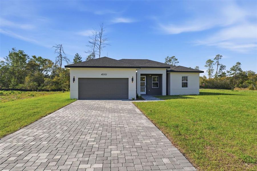 Front exterior of a new home in , Ocala, FL, highlighting curb appeal (Image 21).