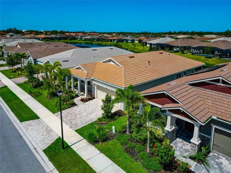 Front exterior of a new home in , Sarasota, FL, highlighting curb appeal (Image 22).