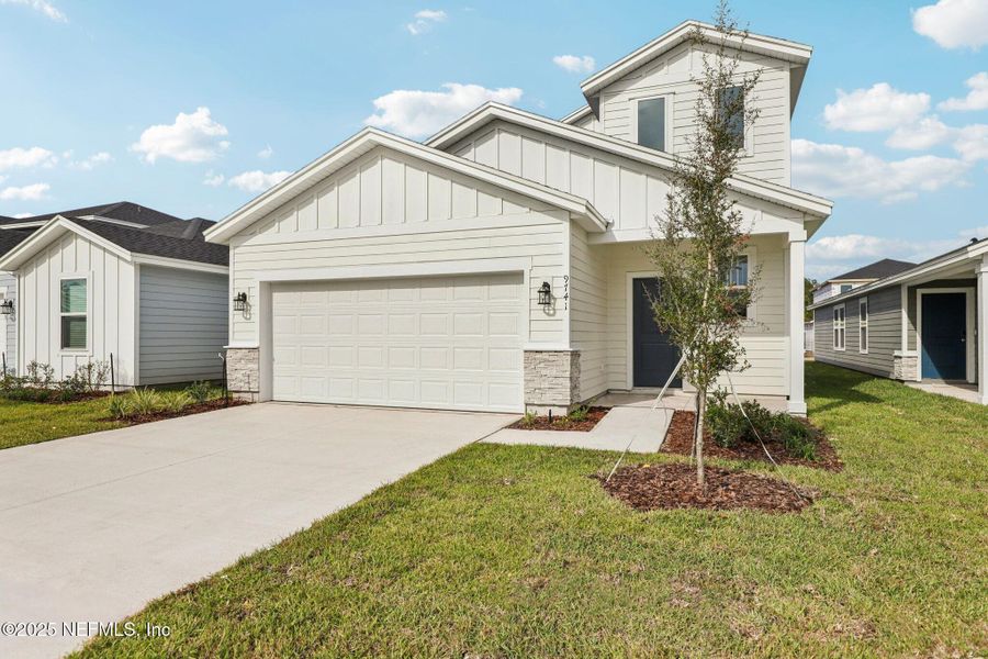 Front exterior of a new home in Cypress Meadows - Classic Series, Jacksonville, FL, highlighting curb appeal (Image 24).