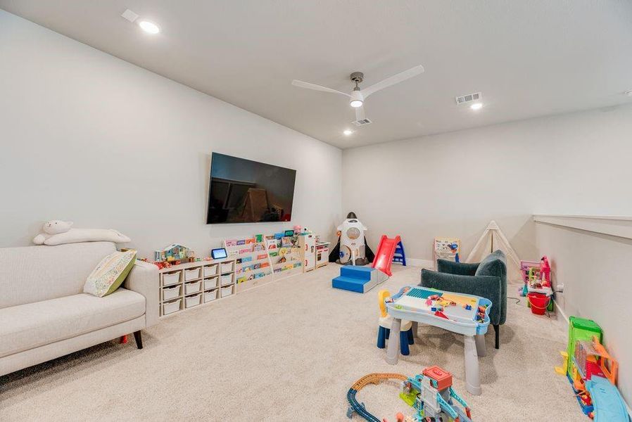 Recreation room featuring carpet flooring, a ceiling fan, and recessed lighting