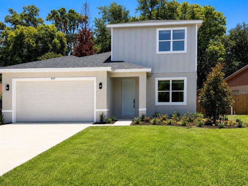 Front exterior of a new home in , Sanford, FL, highlighting curb appeal (Image 2). Front exterior of a new home in , Sanford, FL, highlighting curb appeal (Image 2).