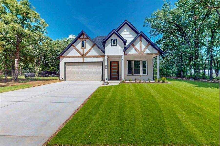 Front exterior of a new home in , Gun Barrel City, TX, highlighting curb appeal (Image 21).
