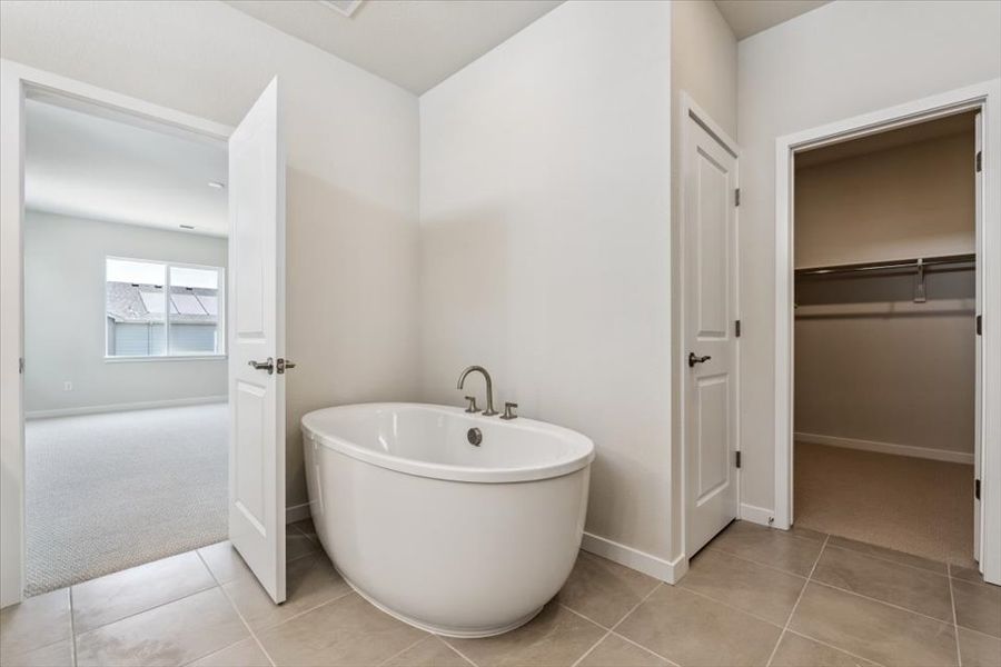 A bathroom with a tub and sink.
