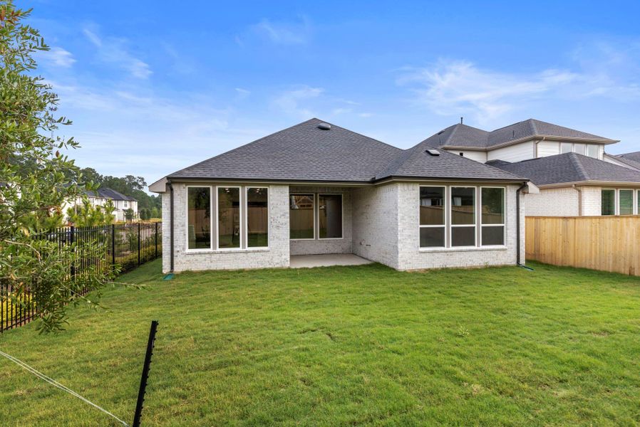 Exterior details and patio area of a home in , The Woodlands (Image 19).