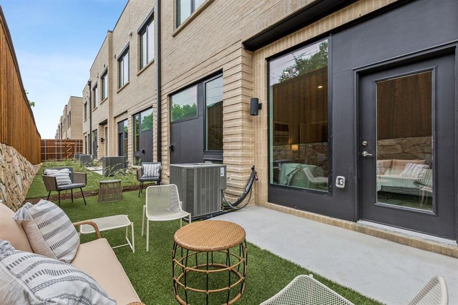 View of patio featuring an outdoor living space and central AC unit